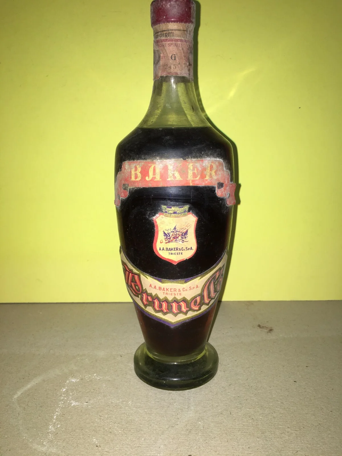Wine, Enology and Liqueurs in Trieste: Baker Prunella Advertising Bottle