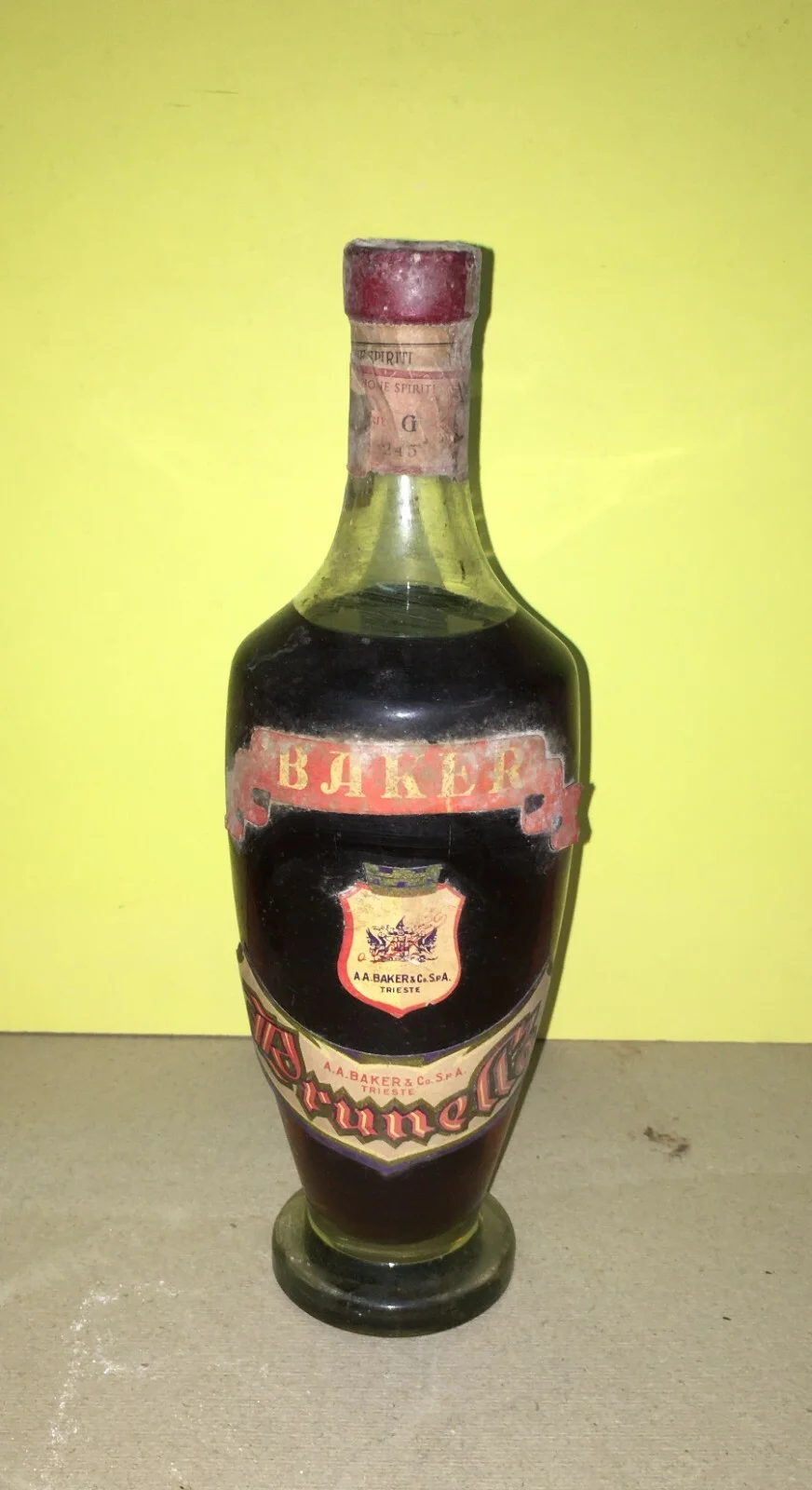 Wine, Enology and Liqueurs in Trieste: Baker Prunella Advertising Bottle