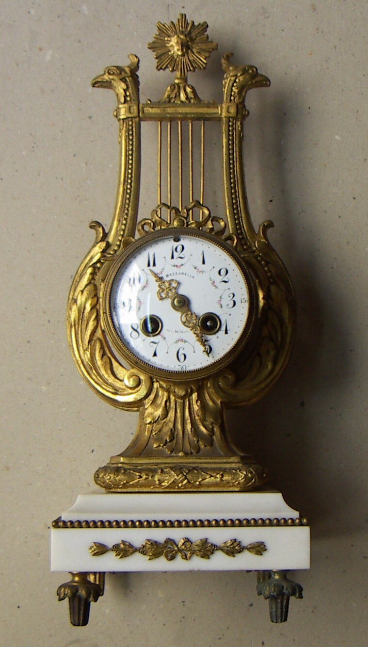 Orologeria Mazzarella: Trittico Da Camino Con Orologio A Lira E Candelabri