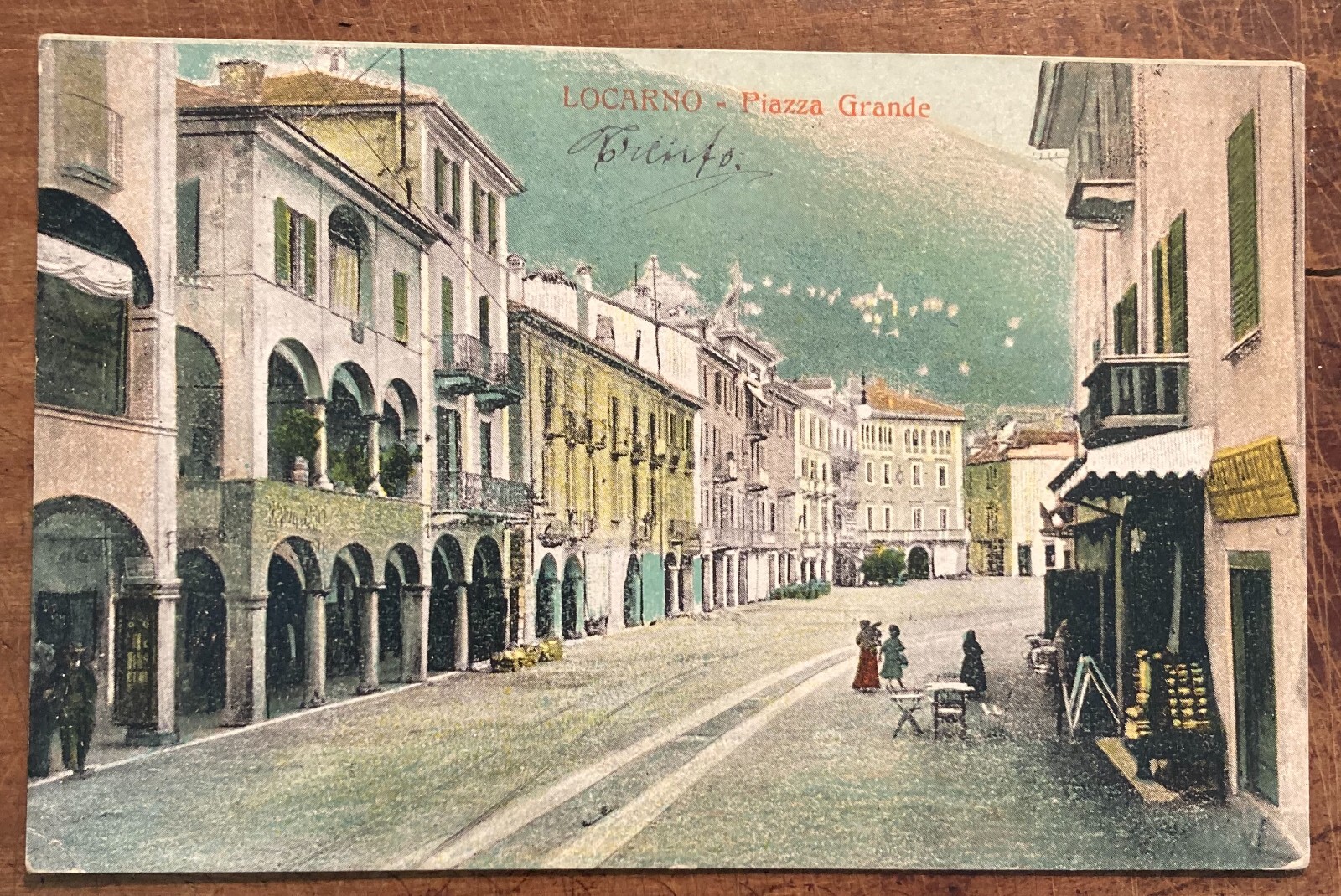 Locarno. Piazza Grande Animata Con Negozi, Antica Cartolina Illustrata A Colori